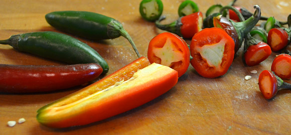 Fresh cut serrano and jalapeño chili peppers. 